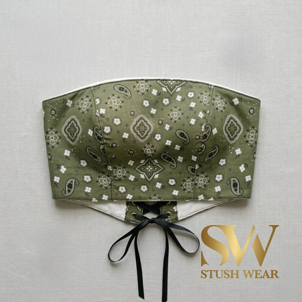 Green bandeau top with pattern and black ribbon on a light gray background, featuring 'Stush Wear' logo.